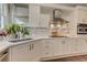Bright kitchen featuring white cabinetry, stainless appliances, and quartz countertops at 4478 Outpost Ct, Roswell, GA 30075