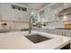 Bright kitchen with white cabinets, a kitchen island with sink, stainless steel appliances, and granite countertops at 4478 Outpost Ct, Roswell, GA 30075