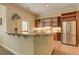 Stylish kitchenette with stainless steel appliances and granite countertops, complete with a breakfast bar and ample storage at 4478 Outpost Ct, Roswell, GA 30075