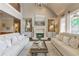 Inviting living room featuring a stone fireplace, vaulted ceilings, and plush sofas at 4478 Outpost Ct, Roswell, GA 30075
