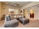 Cozy living room features a large sectional sofa, projector, and views of the kitchen and office at 4478 Outpost Ct, Roswell, GA 30075