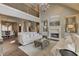 Bright living room with vaulted ceilings, a stone fireplace, and elegant chandelier at 4478 Outpost Ct, Roswell, GA 30075