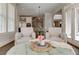 Cozy living room featuring two armchairs and a view of kitchen with stainless appliances at 4478 Outpost Ct, Roswell, GA 30075