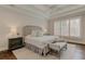 Spacious main bedroom with tray ceiling, plantation shutters, and hardwood floors at 4478 Outpost Ct, Roswell, GA 30075