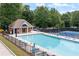 Inviting community pool and tennis courts, providing a perfect recreational oasis with ample seating for relaxation and enjoyment at 4478 Outpost Ct, Roswell, GA 30075