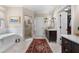 Bathroom with double vanity, soaking tub, and walk-in shower at 927 Amsterdam Ne Ave, Atlanta, GA 30306