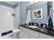 Clean bathroom with subway tile, white vanity, and black countertop at 927 Amsterdam Ne Ave, Atlanta, GA 30306