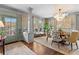 Open dining room with hardwood floors, a round table, and a modern chandelier at 927 Amsterdam Ne Ave, Atlanta, GA 30306