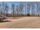Expansive backyard with mature trees, providing a serene and private setting at 305 Glengarry Chase, Covington, GA 30014