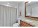 Bathroom featuring a toilet, vanity with a granite countertop and framed mirror at 305 Glengarry Chase, Covington, GA 30014