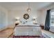 Comfortable bedroom with a queen bed, hardwood floors, and stylish decor at 305 Glengarry Chase, Covington, GA 30014