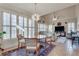 Bright dining area with large windows, modern light fixture, and comfortable seating, great for Gathering meals at 305 Glengarry Chase, Covington, GA 30014