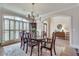 Bright dining room with a wooden table, a large window, and elegant decor at 305 Glengarry Chase, Covington, GA 30014