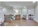 Hallway landing with hardwood floors, elegant trim, and decorative furniture creating a warm and inviting atmosphere at 305 Glengarry Chase, Covington, GA 30014