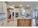 Open kitchen featuring a center island, built-in appliances, and easy access to other living spaces at 305 Glengarry Chase, Covington, GA 30014