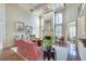 Airy living room features a fireplace, high ceilings, and seamless transitions to other living areas at 305 Glengarry Chase, Covington, GA 30014