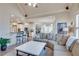 Cozy living area with a large sectional, open to the kitchen and breakfast nook, perfect for entertaining at 305 Glengarry Chase, Covington, GA 30014