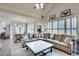 Spacious living room featuring a large sectional sofa and vaulted ceilings with ample natural light at 305 Glengarry Chase, Covington, GA 30014