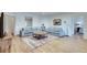 Cozy living room with sofas, a round table, a colorful rug and plenty of natural light at 305 Glengarry Chase, Covington, GA 30014