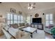 Comfortable living room with plush seating, plantation shutters, and a media center for relaxed entertainment at 305 Glengarry Chase, Covington, GA 30014