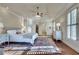 Bright primary bedroom featuring a vaulted ceiling, hardwood floors, and plenty of natural light at 305 Glengarry Chase, Covington, GA 30014