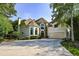 Two-story house with stone accents and a three-car garage at 1431 Olde Forge Ln, Woodstock, GA 30189