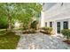 Stone patio adjacent to house and yard at 1431 Olde Forge Ln, Woodstock, GA 30189