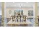 Elegant dining room with hardwood floors, wainscoting, and natural light at 201 Windflower Ct, Canton, GA 30115
