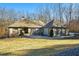 Stunning ranch home with inviting front porch and manicured lawn at 201 Windflower Ct, Canton, GA 30115