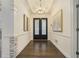 Elegant foyer featuring hardwood floors, decorative doors, and sophisticated lighting fixtures at 201 Windflower Ct, Canton, GA 30115
