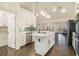 Modern kitchen featuring stainless steel appliances, white cabinets, and an island at 201 Windflower Ct, Canton, GA 30115
