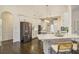 Bright kitchen with stainless appliances, white cabinetry, and a quartz countertop island with seating at 201 Windflower Ct, Canton, GA 30115