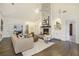 Bright living room with a stone fireplace, vaulted ceiling, and hardwood flooring at 201 Windflower Ct, Canton, GA 30115