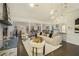 Spacious living room with stone fireplace, hardwood flooring, and an open floor plan at 201 Windflower Ct, Canton, GA 30115
