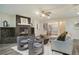Open living room with a stone fireplace, wood floors, and comfortable seating at 201 Windflower Ct, Canton, GA 30115