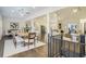 Open-concept dining area and living room, bright with natural light and hardwood floors at 201 Windflower Ct, Canton, GA 30115