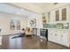 Cozy sitting area with hardwood floors, custom cabinets, and natural light at 201 Windflower Ct, Canton, GA 30115