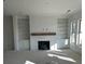 Living room area with a fireplace, built-in shelving, large windows, and natural light at 4213 Legacy Ln # 32, Acworth, GA 30101