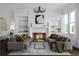 Beautifully decorated living room with a fireplace, built-in shelves, comfortable seating, and a modern chandelier at 4213 Legacy Ln # 32, Acworth, GA 30101