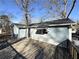 Wooden deck overlooks backyard with mature trees at 210 Joe Louis Nw Dr, Atlanta, GA 30314