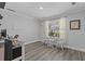 Home office with wood floors, a window, and space for two chairs at 3828 Briarstone Cv, Snellville, GA 30039