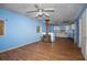 Living room with wood flooring, wood burning stove, and ceiling fan at 388 Highway 20 Spur, Cartersville, GA 30121