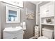 Clean bathroom with white vanity and storage at 4297 Earney Rd, Woodstock, GA 30188