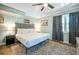 Cozy bedroom with a plush bed, soft lighting, and neutral color palette at 4297 Earney Rd, Woodstock, GA 30188