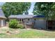 Back of house showing deck and surrounding yard at 4297 Earney Rd, Woodstock, GA 30188