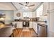 Cozy kitchen features white cabinetry, stainless steel appliances and a ceiling fan at 4297 Earney Rd, Woodstock, GA 30188