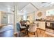 View of kitchen with white cabinets that flows into the living room area at 4297 Earney Rd, Woodstock, GA 30188