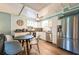 Bright kitchen with stainless steel appliances, white cabinetry and dining area at 4297 Earney Rd, Woodstock, GA 30188