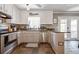 Modern kitchen with stainless steel appliances and granite countertops at 4297 Earney Rd, Woodstock, GA 30188