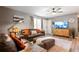Comfortable living room featuring a sectional sofa and a large TV at 4297 Earney Rd, Woodstock, GA 30188